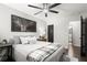 A comfortable bedroom featuring a ceiling fan and a coordinated color palette at 5605 Miners Rdg, Cumming, GA 30028