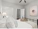 Cozy bedroom with soft lighting, plush pillows, and a decorative wall art, perfect for relaxation at 5605 Miners Rdg, Cumming, GA 30028