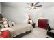 Cozy bedroom featuring neutral colors, with a ceiling fan and a red dresser at 5605 Miners Rdg, Cumming, GA 30028