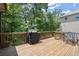 Enjoy outdoor living with a wooden deck, perfect for grilling and relaxing with an outdoor grill at 5605 Miners Rdg, Cumming, GA 30028