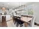 Open concept dining area leading to modern kitchen with lots of natural light at 5605 Miners Rdg, Cumming, GA 30028