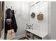 Stylish entryway with a coat rack, built-in bench, and decorative wall accents at 5605 Miners Rdg, Cumming, GA 30028