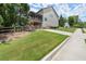 Exterior of home, with a fenced backyard, leading to a concrete driveway at 5605 Miners Rdg, Cumming, GA 30028