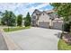 Lovely home featuring a two-car garage, a basketball hoop, and a well-maintained yard at 5605 Miners Rdg, Cumming, GA 30028