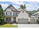 Beautiful two-story home with a two-car garage, and a welcoming front porch, perfect for relaxation at 5605 Miners Rdg, Cumming, GA 30028