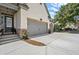 Brick home with multi-car garage, well landscaped yard and entryway at 5605 Miners Rdg, Cumming, GA 30028