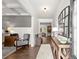 Elegant foyer with hardwood floors, neutral decor, and a glimpse into other living spaces at 5605 Miners Rdg, Cumming, GA 30028