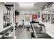 This well-equipped home gym features mirrors, weights, and a Superfit treadmill at 5605 Miners Rdg, Cumming, GA 30028