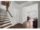 Inviting hallway with hardwood floors and stairs leading to the upper level at 5605 Miners Rdg, Cumming, GA 30028