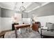 Cozy home office with white board and batten walls, wood floors and vintage rug at 5605 Miners Rdg, Cumming, GA 30028