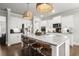 Charming kitchen with white cabinets, granite island, and stainless appliances at 5605 Miners Rdg, Cumming, GA 30028