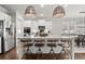 Stylish kitchen with island seating, stainless steel appliances, and modern pendant lighting at 5605 Miners Rdg, Cumming, GA 30028