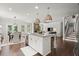 Open concept kitchen with granite island open to dining and living room at 5605 Miners Rdg, Cumming, GA 30028