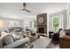 Bright living room with fireplace, hardwood floors and an open concept design at 5605 Miners Rdg, Cumming, GA 30028