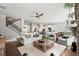Open-concept living space with kitchen, dining, and living areas flowing seamlessly together at 5605 Miners Rdg, Cumming, GA 30028