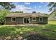 Backyard featuring a patio and well-maintained lawn at 1050 Chapman Circle Cir, Stone Mountain, GA 30088