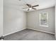Bedroom featuring a ceiling fan, window, and plush carpeting at 1050 Chapman Circle Cir, Stone Mountain, GA 30088