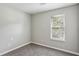 Bedroom featuring natural light from a window and plush carpeting at 1050 Chapman Circle Cir, Stone Mountain, GA 30088
