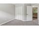 Bedroom featuring closet, plush carpet, and doorway to hallway at 1050 Chapman Circle Cir, Stone Mountain, GA 30088