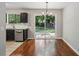 Inviting dining area features a window and sliding glass door with backyard views at 1050 Chapman Circle Cir, Stone Mountain, GA 30088