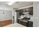 Well-appointed kitchen features granite countertops, stainless steel appliances, and modern black cabinetry at 1050 Chapman Circle Cir, Stone Mountain, GA 30088