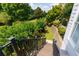 Beautiful backyard featuring a well maintained lawn, a stone retaining wall, and mature landscaping at 130 Hamilton Way, Roswell, GA 30075
