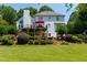 Expansive backyard featuring lush landscaping, a spacious deck, and a well-maintained lawn at 130 Hamilton Way, Roswell, GA 30075