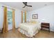 Cozy bedroom with hardwood floors and large windows that bring in natural light at 130 Hamilton Way, Roswell, GA 30075