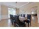 Elegant dining room with hardwood floors and ample seating for large gatherings at 130 Hamilton Way, Roswell, GA 30075
