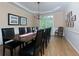 Elegant dining room with hardwood floors, stylish chandelier, and ample seating for large gatherings at 130 Hamilton Way, Roswell, GA 30075