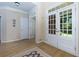 Bright foyer with hardwood flooring, double doors, and elegant trim at 130 Hamilton Way, Roswell, GA 30075