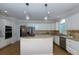 Beautiful kitchen with granite countertops, stainless steel appliances, and an island perfect for cooking at 130 Hamilton Way, Roswell, GA 30075