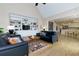 Open living room features a vaulted ceiling, a built in bookcase and hardwood floors at 130 Hamilton Way, Roswell, GA 30075