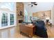 Spacious living room with fireplace, french doors and large windows provide abundant natural light at 130 Hamilton Way, Roswell, GA 30075