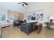 Open living room features a vaulted ceiling, a built in bookcase and hardwood floors at 130 Hamilton Way, Roswell, GA 30075