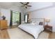 Spacious main bedroom featuring hardwood floors, vaulted ceiling and large windows at 130 Hamilton Way, Roswell, GA 30075