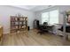 Bright home office featuring a large window, desk, and shelving for organized storage at 130 Hamilton Way, Roswell, GA 30075