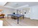 Finished recreation room with ping pong table, recessed lights, light colored walls and new flooring at 130 Hamilton Way, Roswell, GA 30075