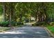 Serene street with a view of beautiful homes and lush trees at 130 Hamilton Way, Roswell, GA 30075