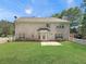 Spacious backyard with green grass, brick house, and white picket fence at 1525 Lake Dow Rd, Mcdonough, GA 30252