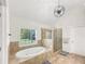 Bright bathroom featuring soaking tub, glass shower, and modern fixtures at 1525 Lake Dow Rd, Mcdonough, GA 30252