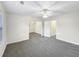 Carpeted bedroom with neutral walls and a ceiling fan, offering a comfortable and versatile space at 1525 Lake Dow Rd, Mcdonough, GA 30252