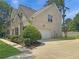 Beautiful brick house with well-manicured lawn and attached garage at 1525 Lake Dow Rd, Mcdonough, GA 30252