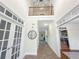 Grand foyer with high ceilings, hardwood floors, and elegant staircase at 1525 Lake Dow Rd, Mcdonough, GA 30252