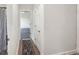 Bright hallway with decorative runner rug and access to bathroom and bedroom at 1525 Lake Dow Rd, Mcdonough, GA 30252