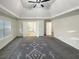 Expansive main bedroom boasts tray ceilings, a ceiling fan and features an adjoined bathroom at 1525 Lake Dow Rd, Mcdonough, GA 30252