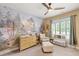 Charming Bedroom with forest mural, dresser changing table and cozy chair, perfect for a growing Gathering at 2317 Whiting Bay Courts Nw, Kennesaw, GA 30152