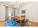 Bright dining room with modern lighting, hardwood floors, and seating for six at 2317 Whiting Bay Courts Nw, Kennesaw, GA 30152