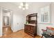 Dining room with hardwood flooring, decorative wood hutch, plantation shutters, and chandelier at 2317 Whiting Bay Courts Nw, Kennesaw, GA 30152