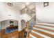 Bright entryway with hardwood floors, staircase and a view to the formal dining room at 2317 Whiting Bay Courts Nw, Kennesaw, GA 30152